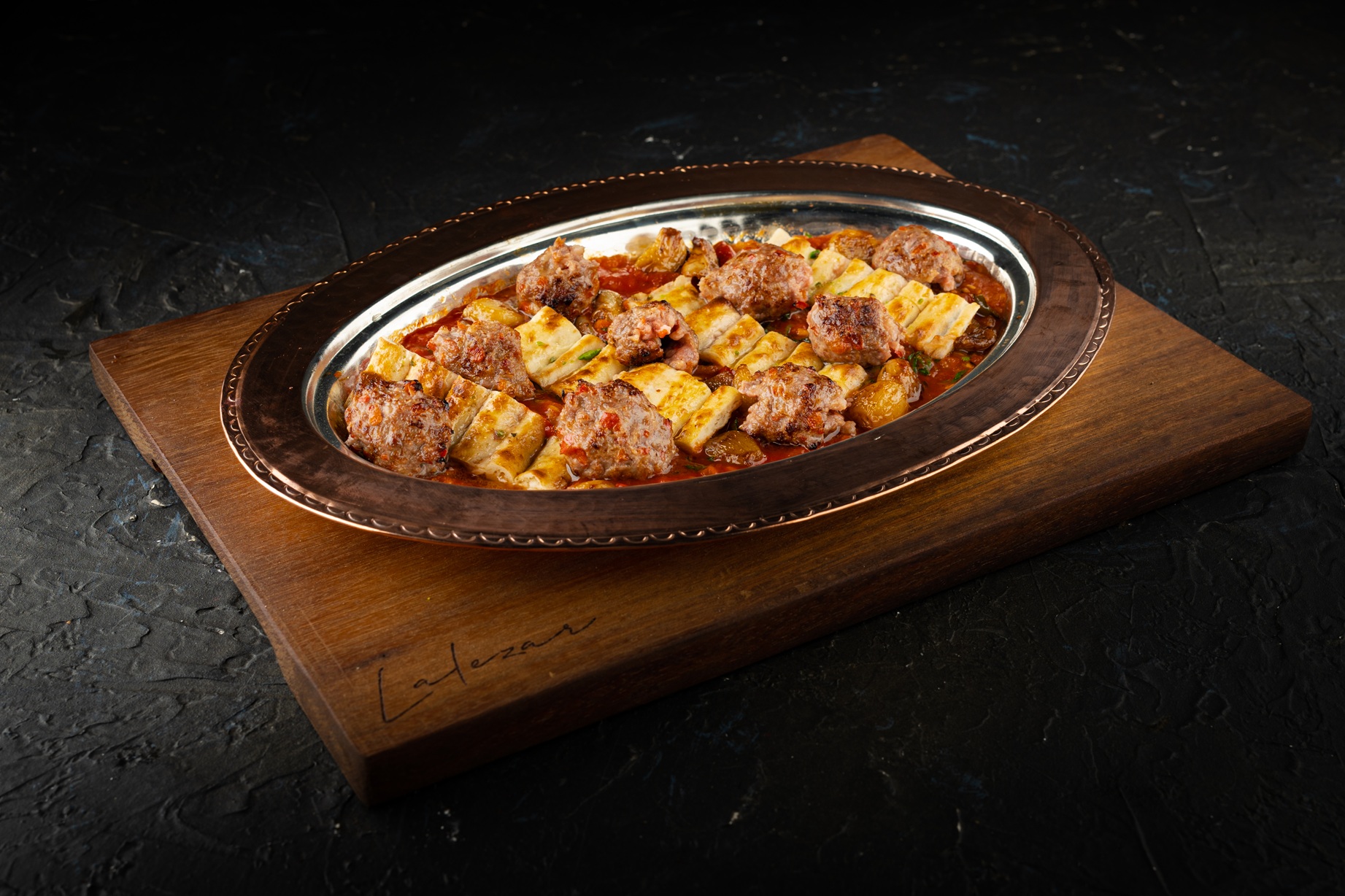 Altı Ezme Kebab (grilled minced Lamb Kebab Under Spicy Ezme Sauce)